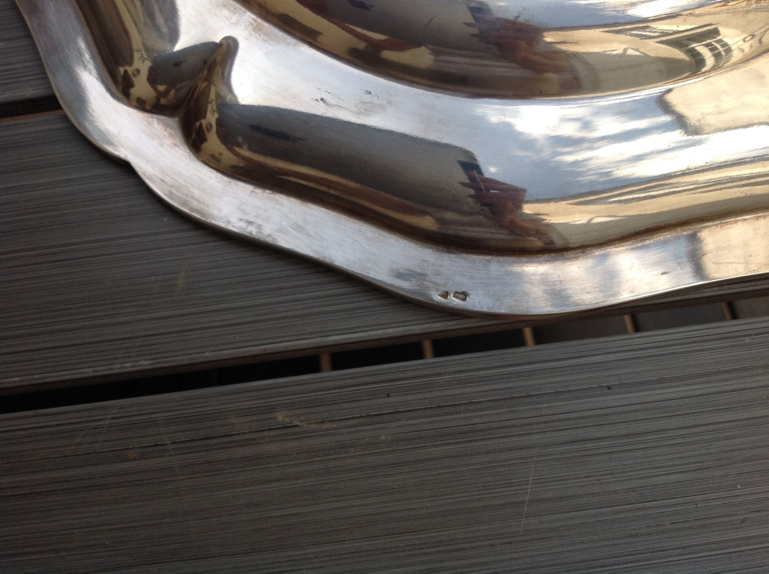Silver metal dish with twisted edges