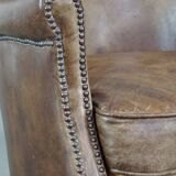 Fauteuil en cuir subtil avec coussin d'assise réversible en kilim