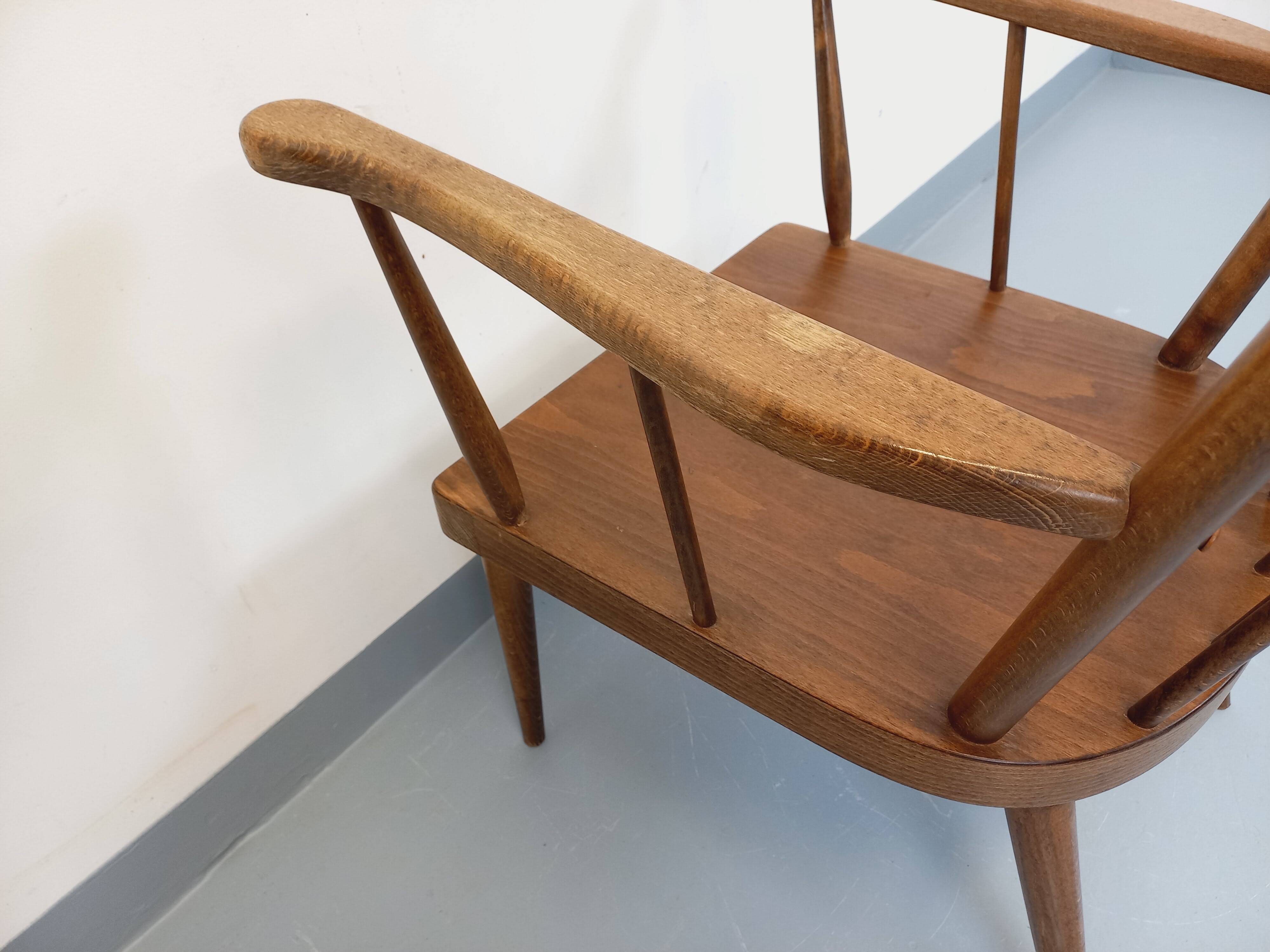 Vintage wooden armchair Baumann model Éventail from the 1960s.