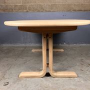 Oval extendable dining table in beech with Danish design.
