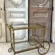 Rolling bar cart in brass and bronze circa 1960