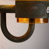Pair of brass wall lamps with decorated amber coloured shades