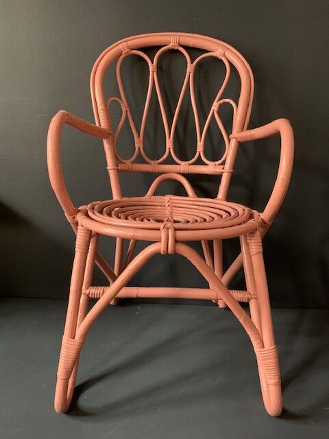 Vintage pink rattan armchair