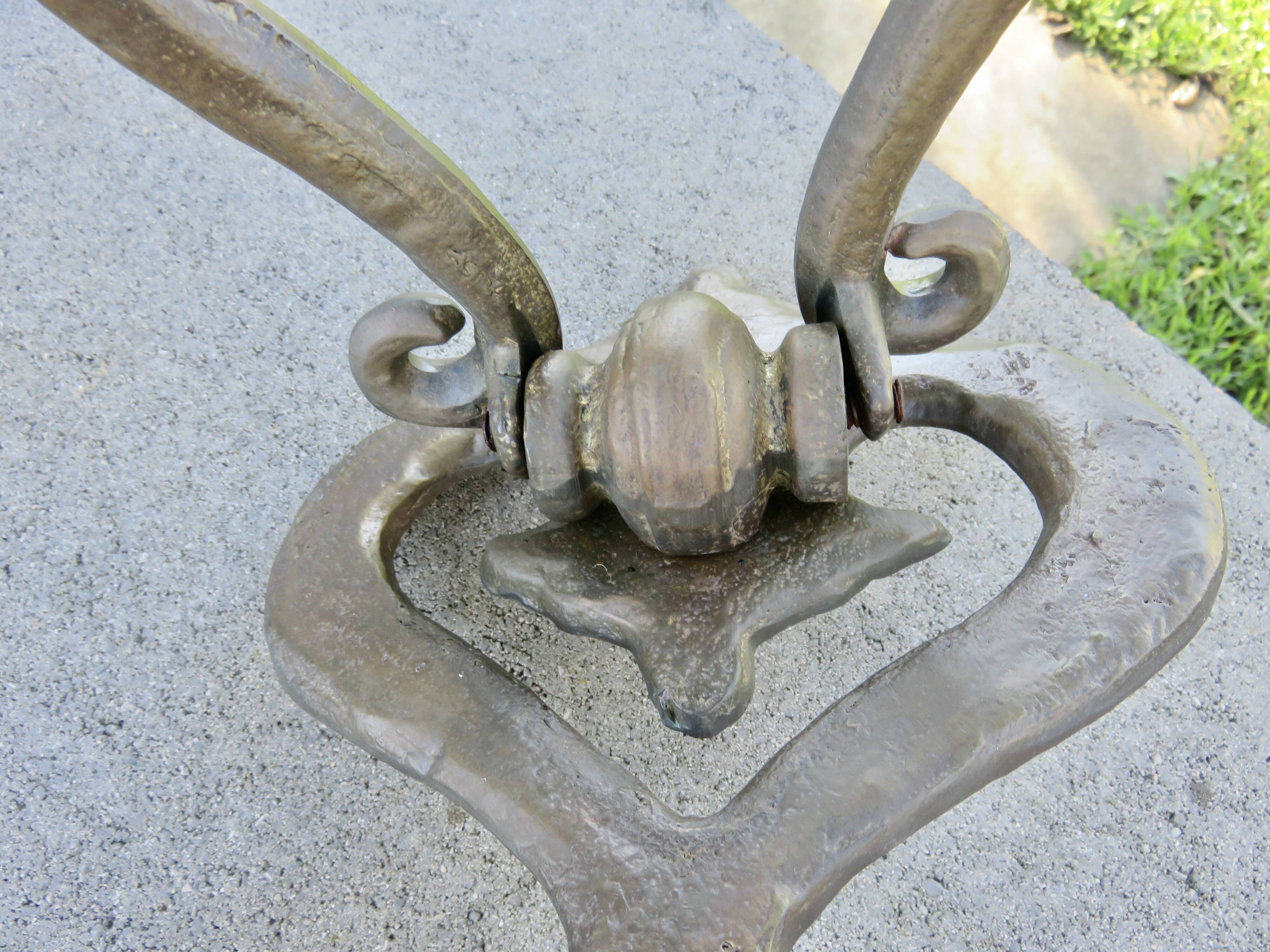 Impressive door knocker from the High Middle Ages in solid bronze.