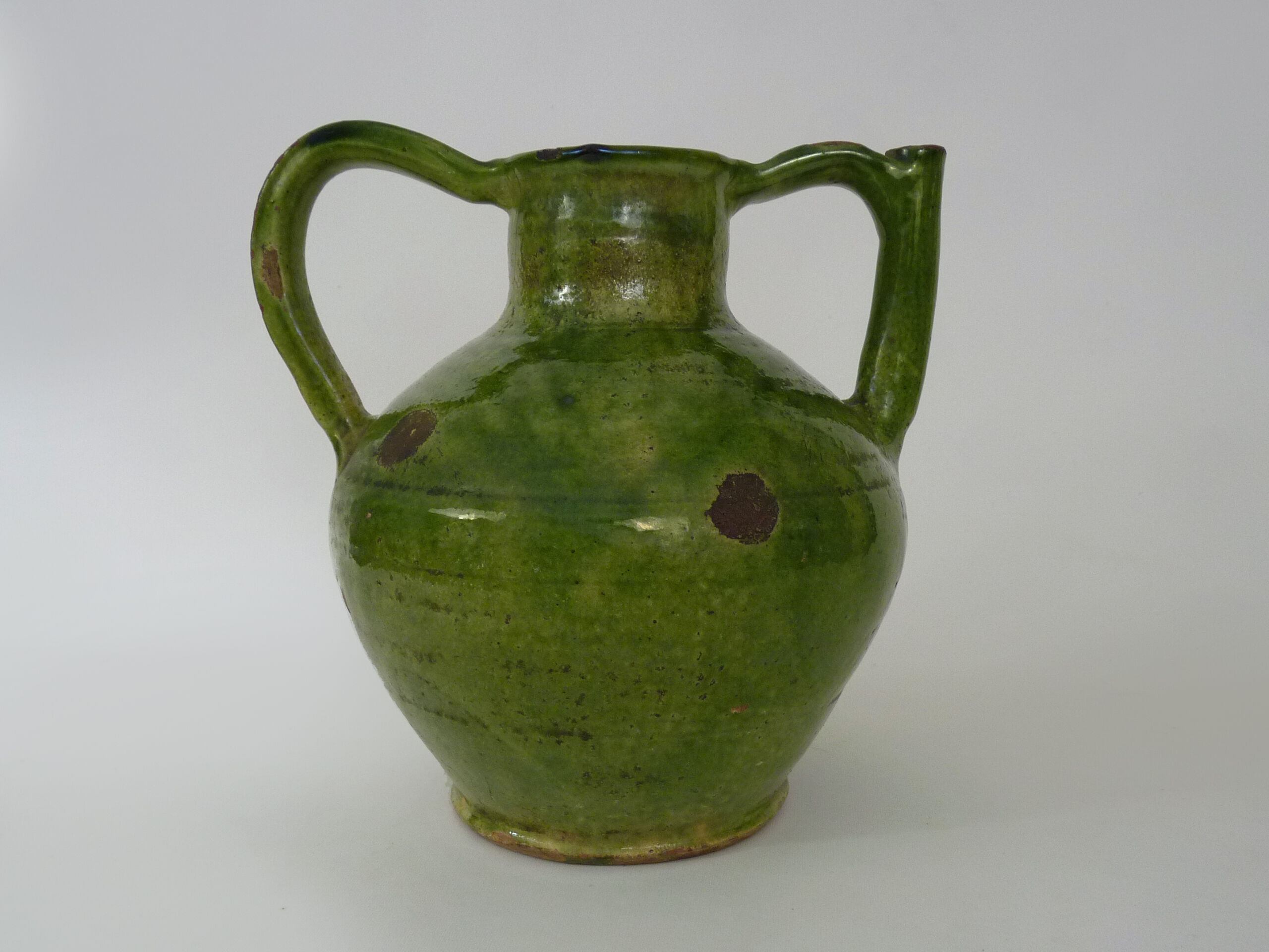 Pitcher pottery in green glazed terracotta, south west of France. XIXth