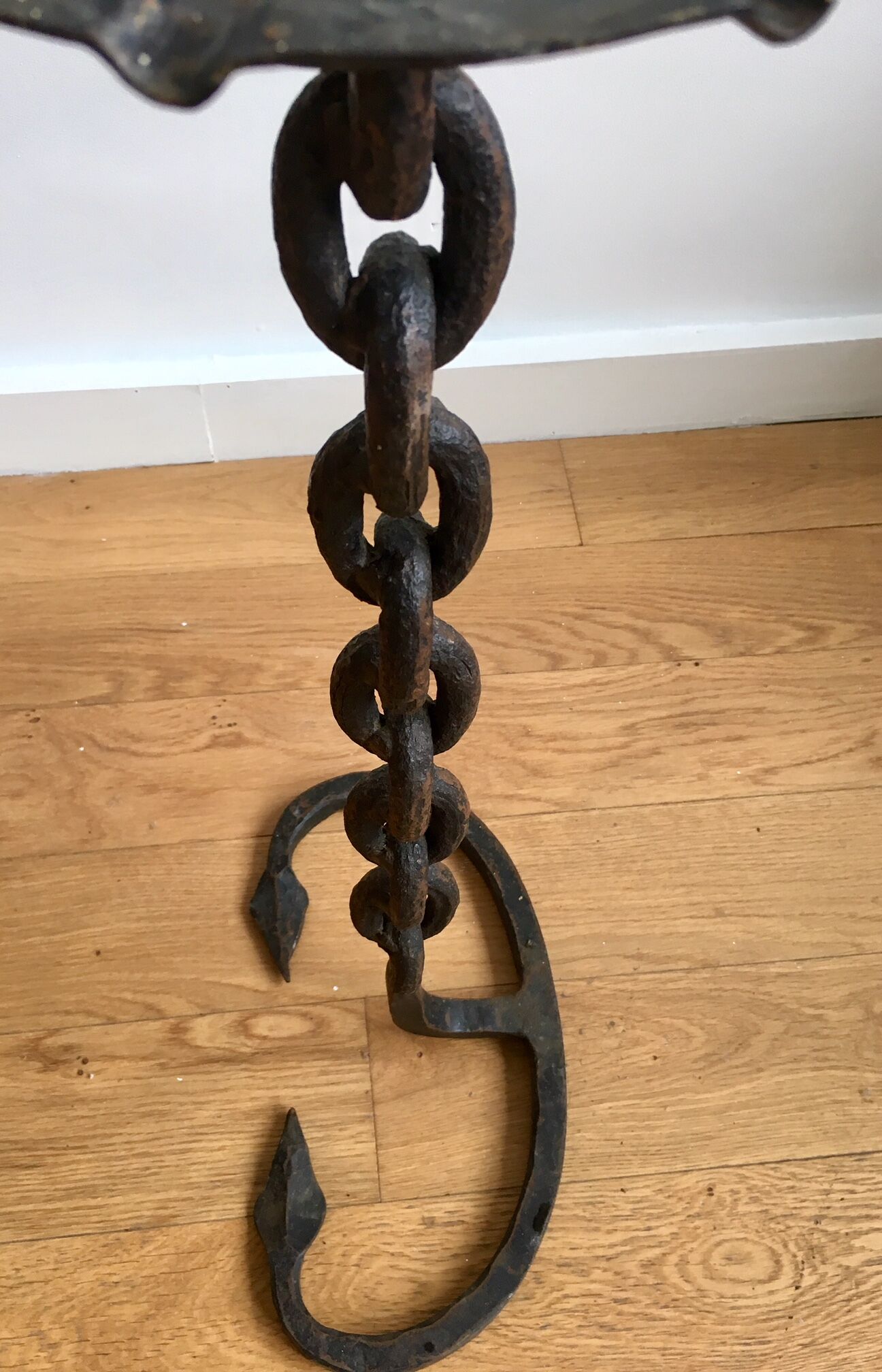 Wrought iron ashtray on its chain and anchor foot