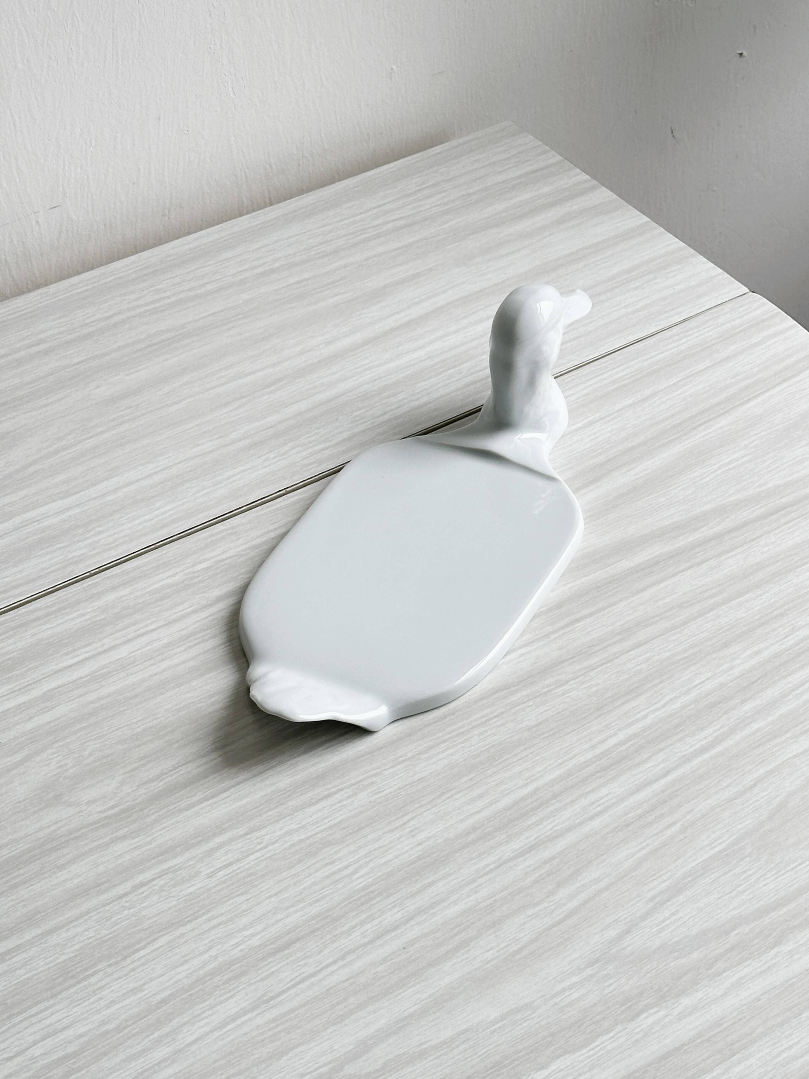 White porcelain dish in the shape of a duck.