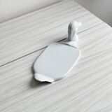 White porcelain dish in the shape of a duck.