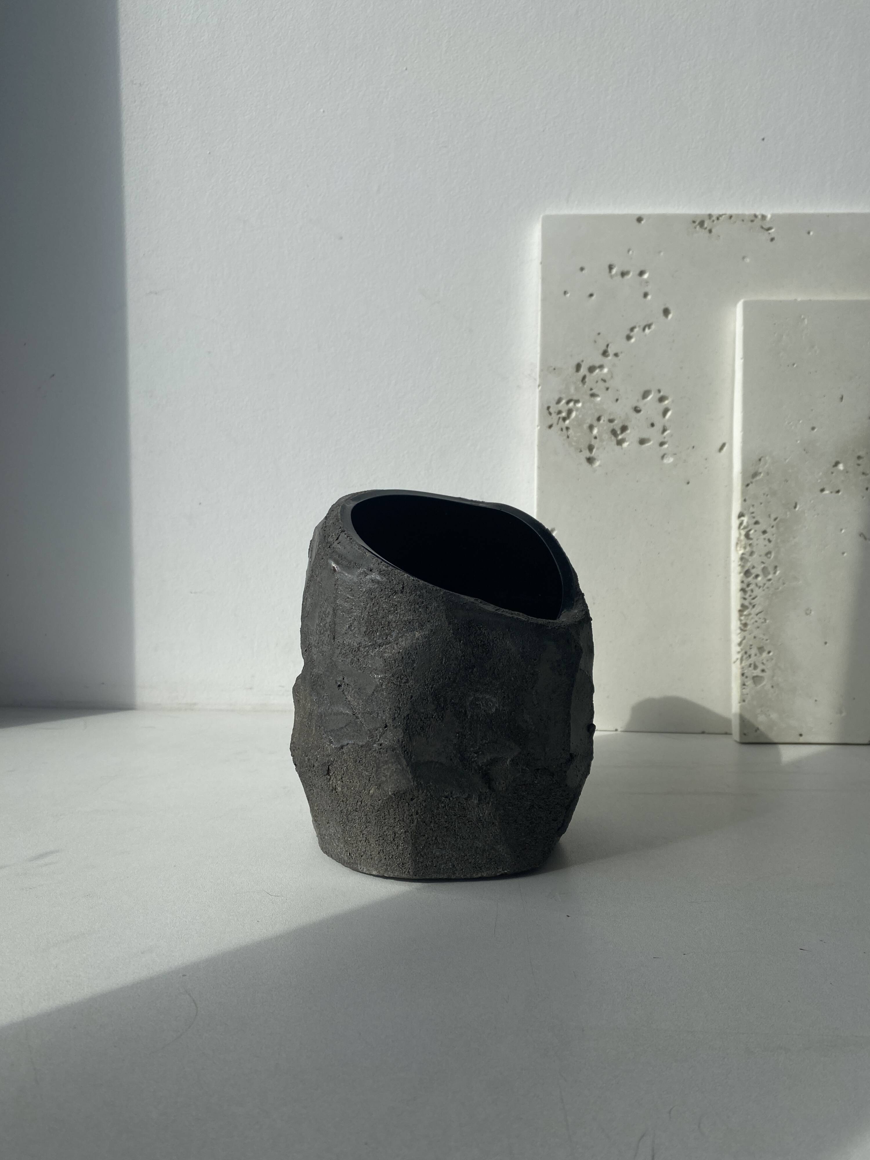 Asymmetrical sculpted concrete vase