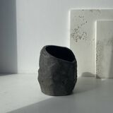 Asymmetrical sculpted concrete vase