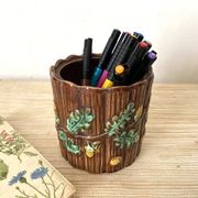 Antique slip pot with acorn decoration