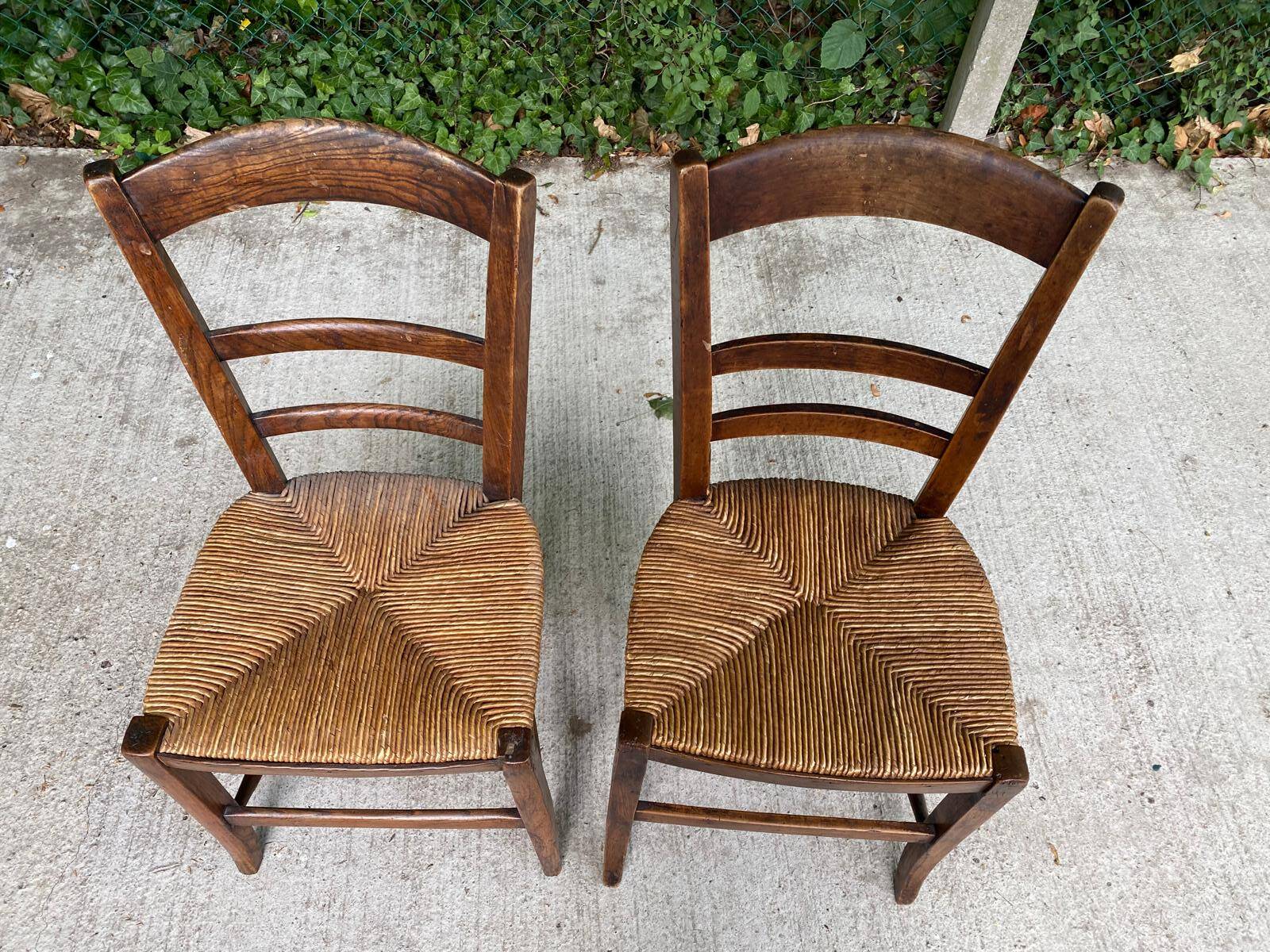 2 solid oak and straw wood chairs