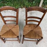 2 solid oak and straw wood chairs