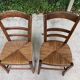 2 solid oak and straw wood chairs