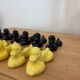Box of 12 dog-shaped cutlery rests in yellow and black majolica.