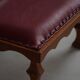 Danish sculpted oak stool from the mid-20th century with a red leather seat, 1950s.