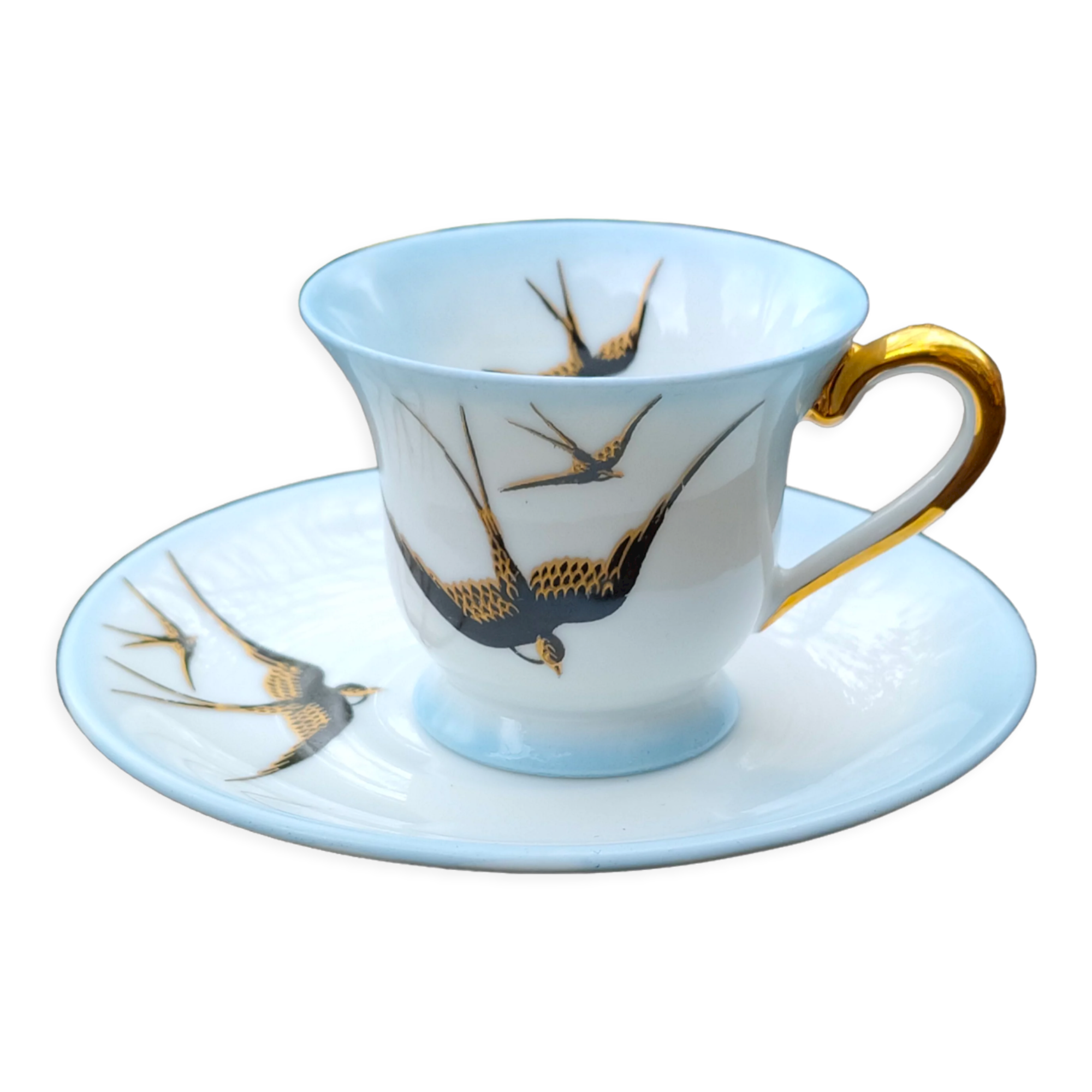 Tasse et sa soucoupe en porcelaine de Limoges motif "hirondelles"