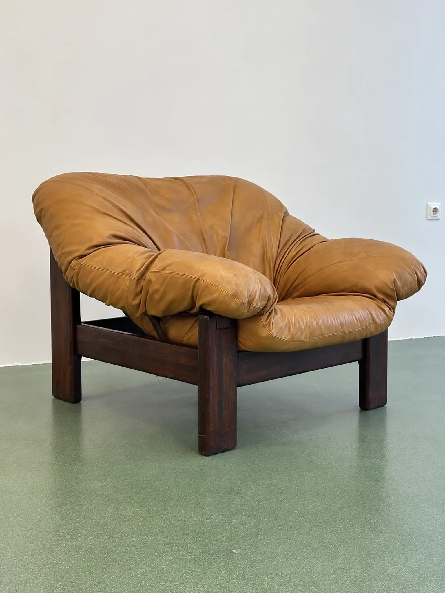 Pair of brutalist leather lounge chairs, 1960s