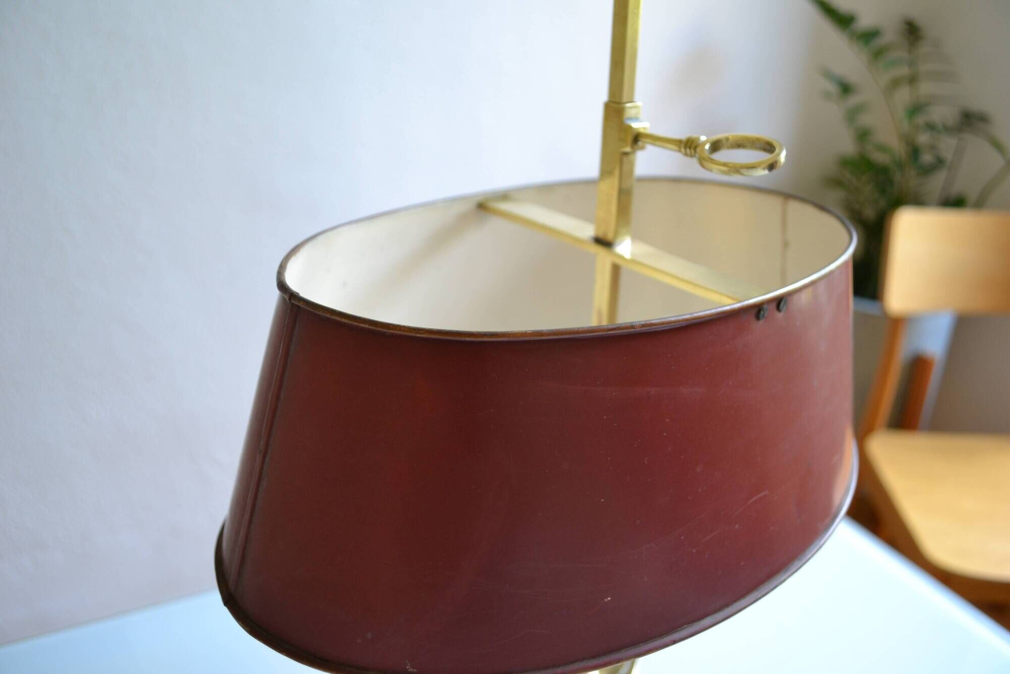 hot water bottle lamp with 2 bronze lights and burgundy sheet metal lampshade