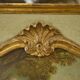 Trumeau mirror with cracked patina and oil on panel depicting a romantic scene from the 19th century.