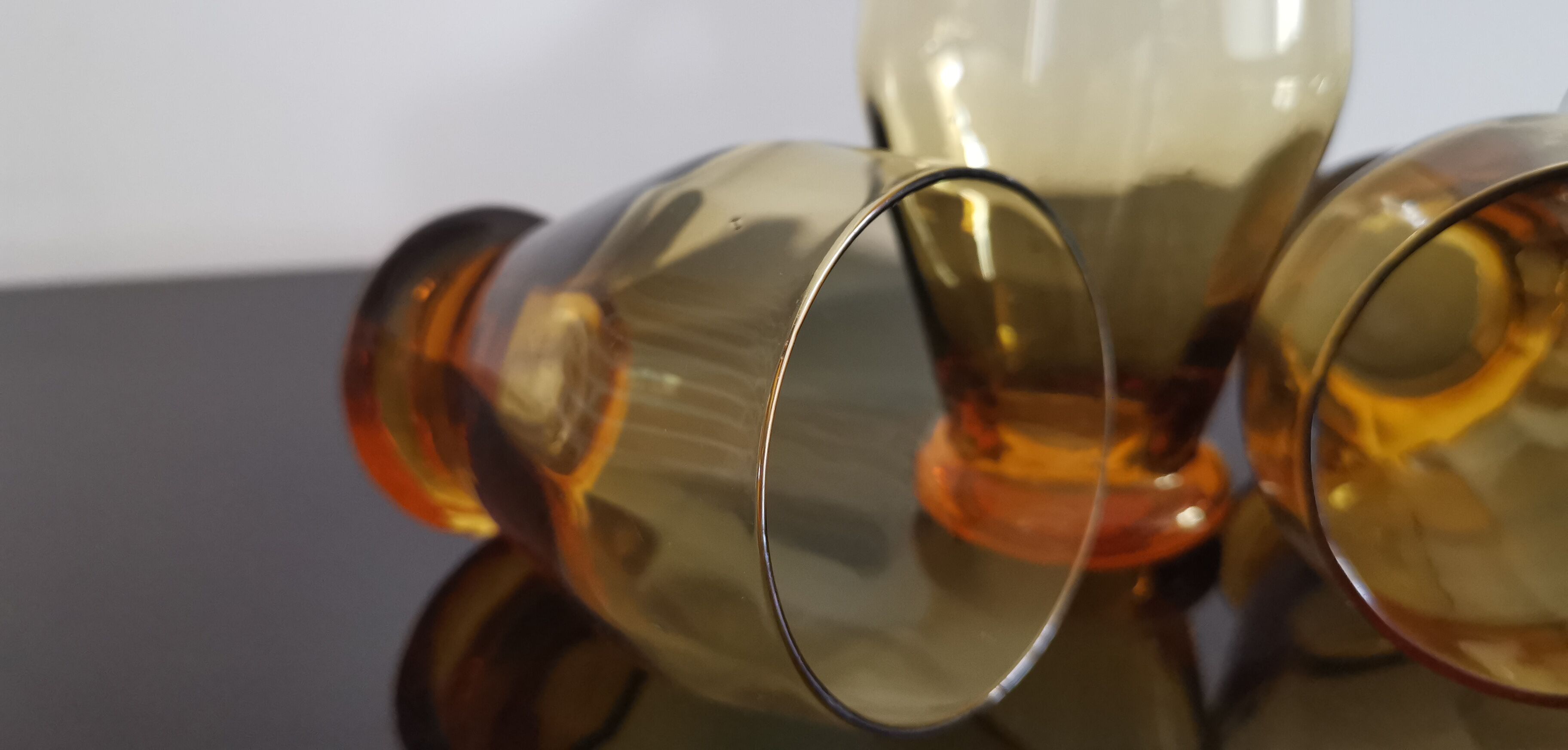 4 old amber colored glasses