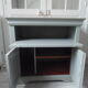 Louis Philippe-style storage furniture with grey wood tray, it is composed of a niche with sliding tray and below a storage closed by 2 doors.