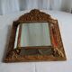 Mirror with parecloses
