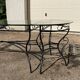 Glass and iron table with two side tables and 8 chairs