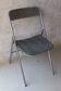 Vintage folding chair in chrome metal and chevron fabric.
