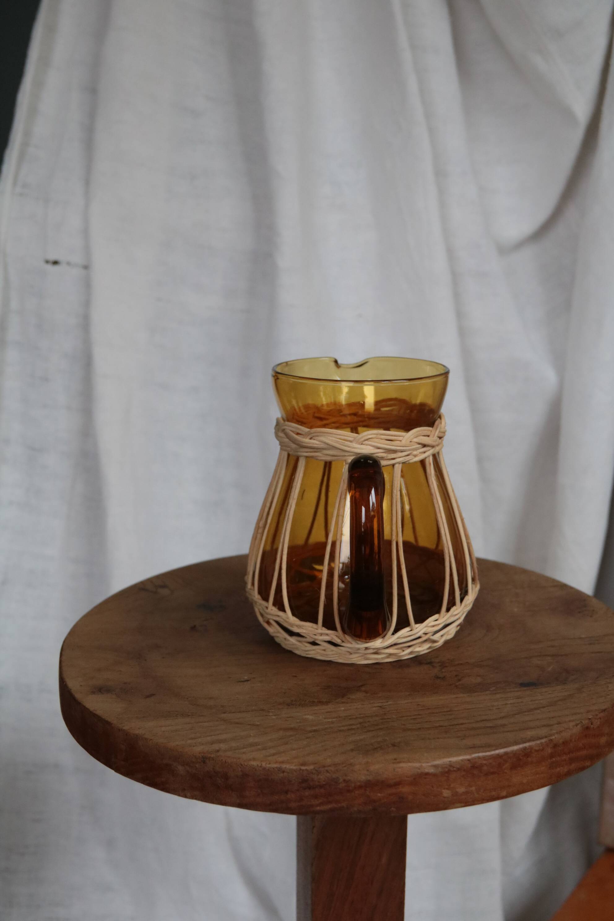 Amber glass and wicker carafe