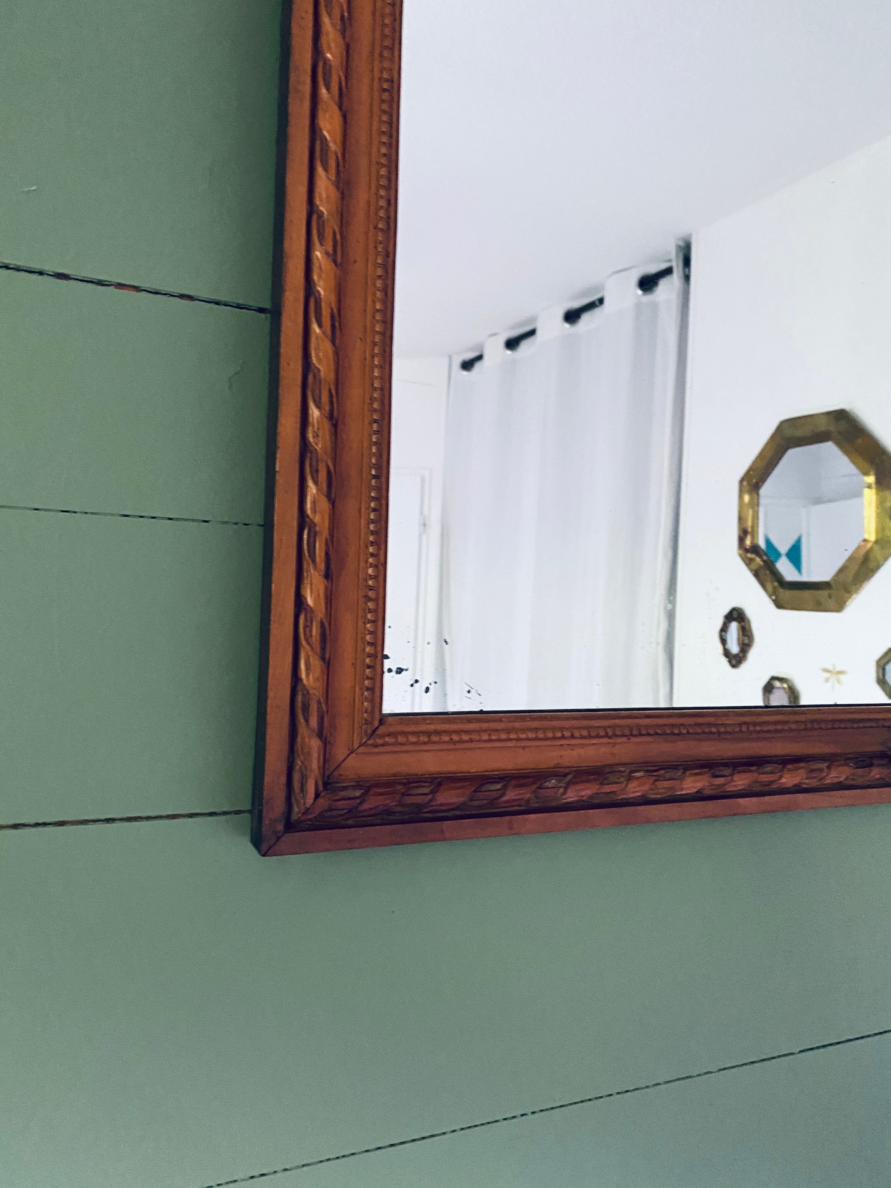 Antique mirror in carved wood and mercury 48x63cm