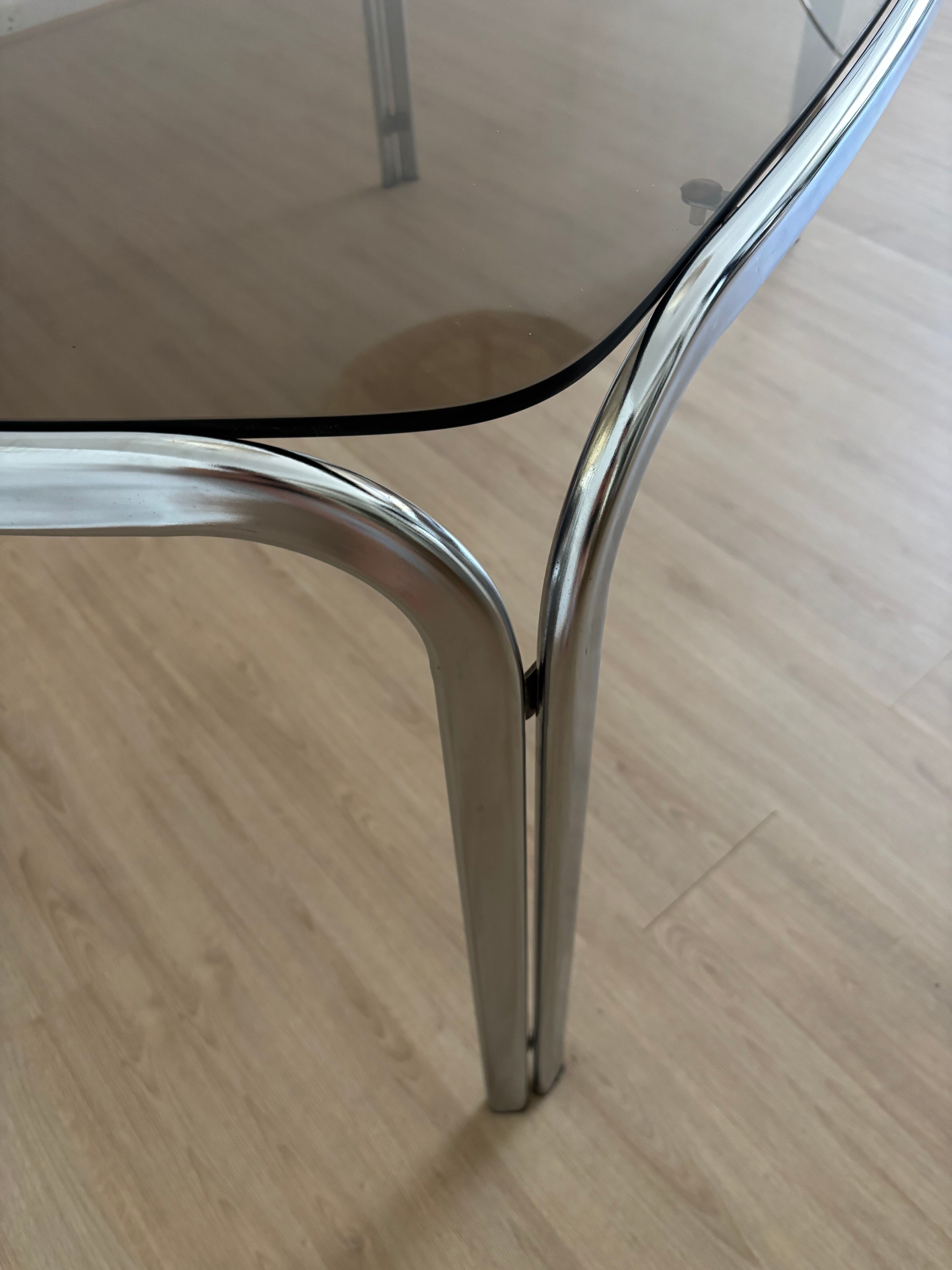 Smoked glass dining table from the 1970s.