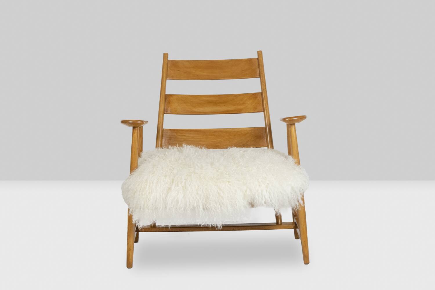 Pair of “lounge” armchairs in blond beech. 1950s