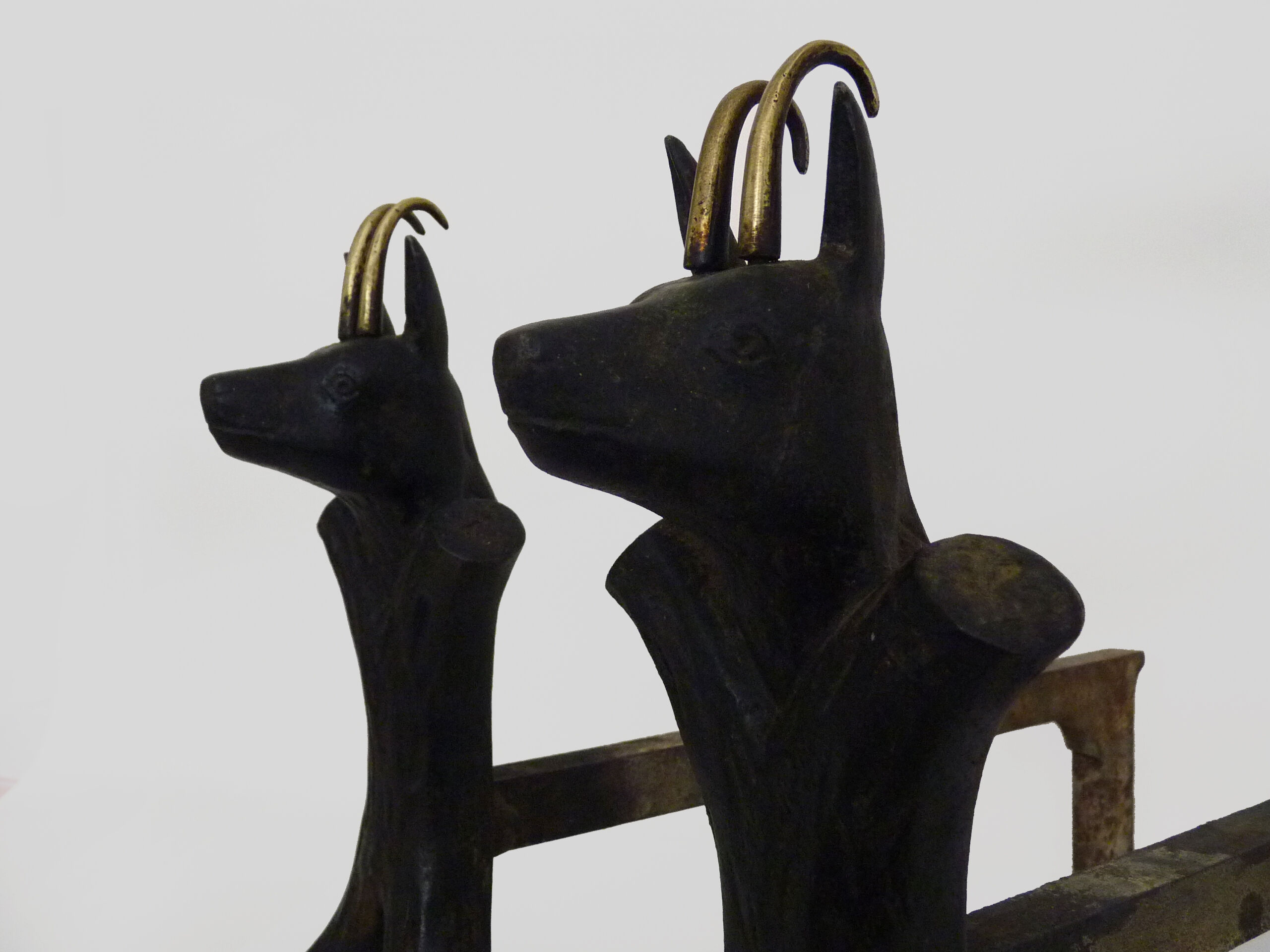 Pair of zoomorphic cast iron chimney pegs representing Isards. 50s
