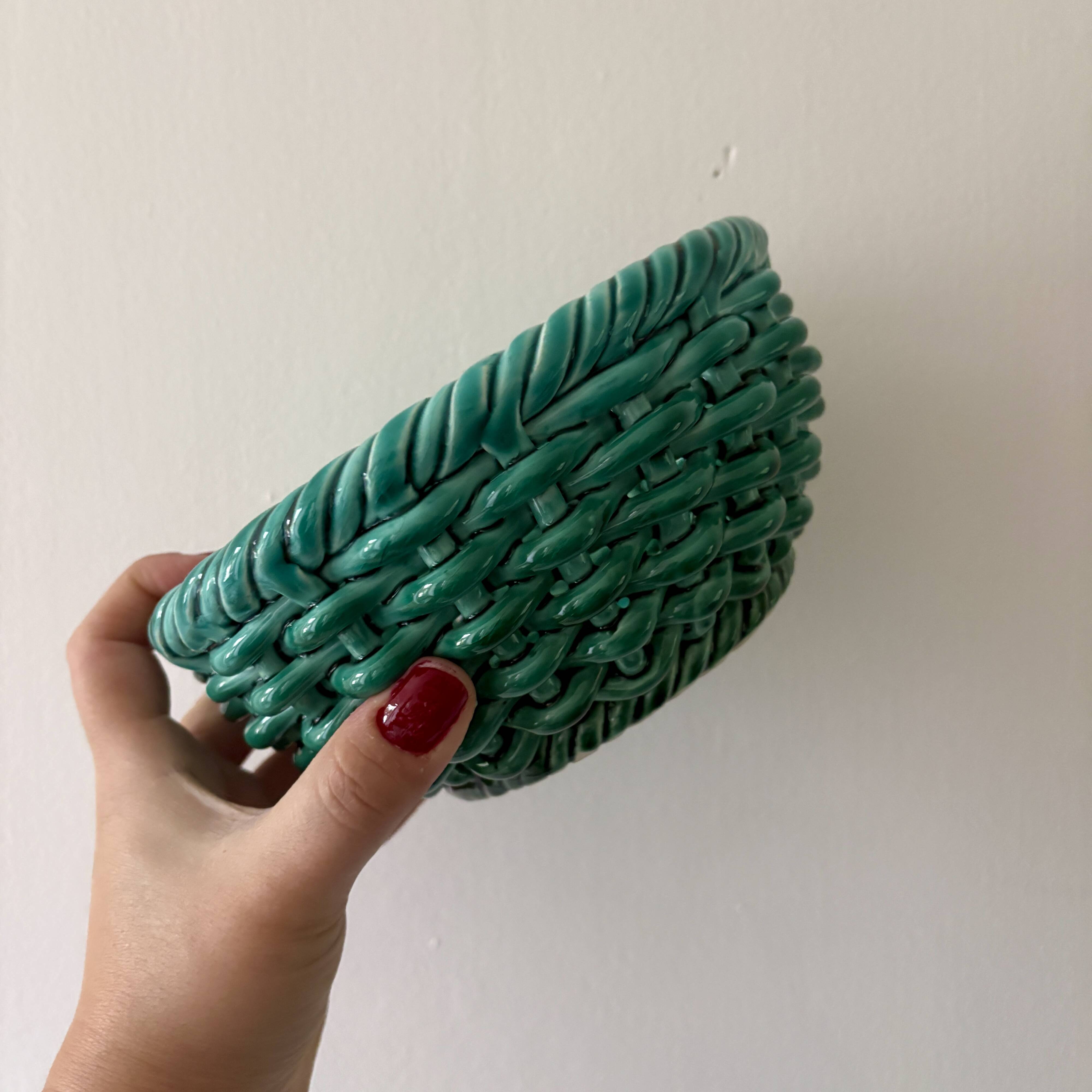 Vintage green earthenware plate/basket with fruit decorations.