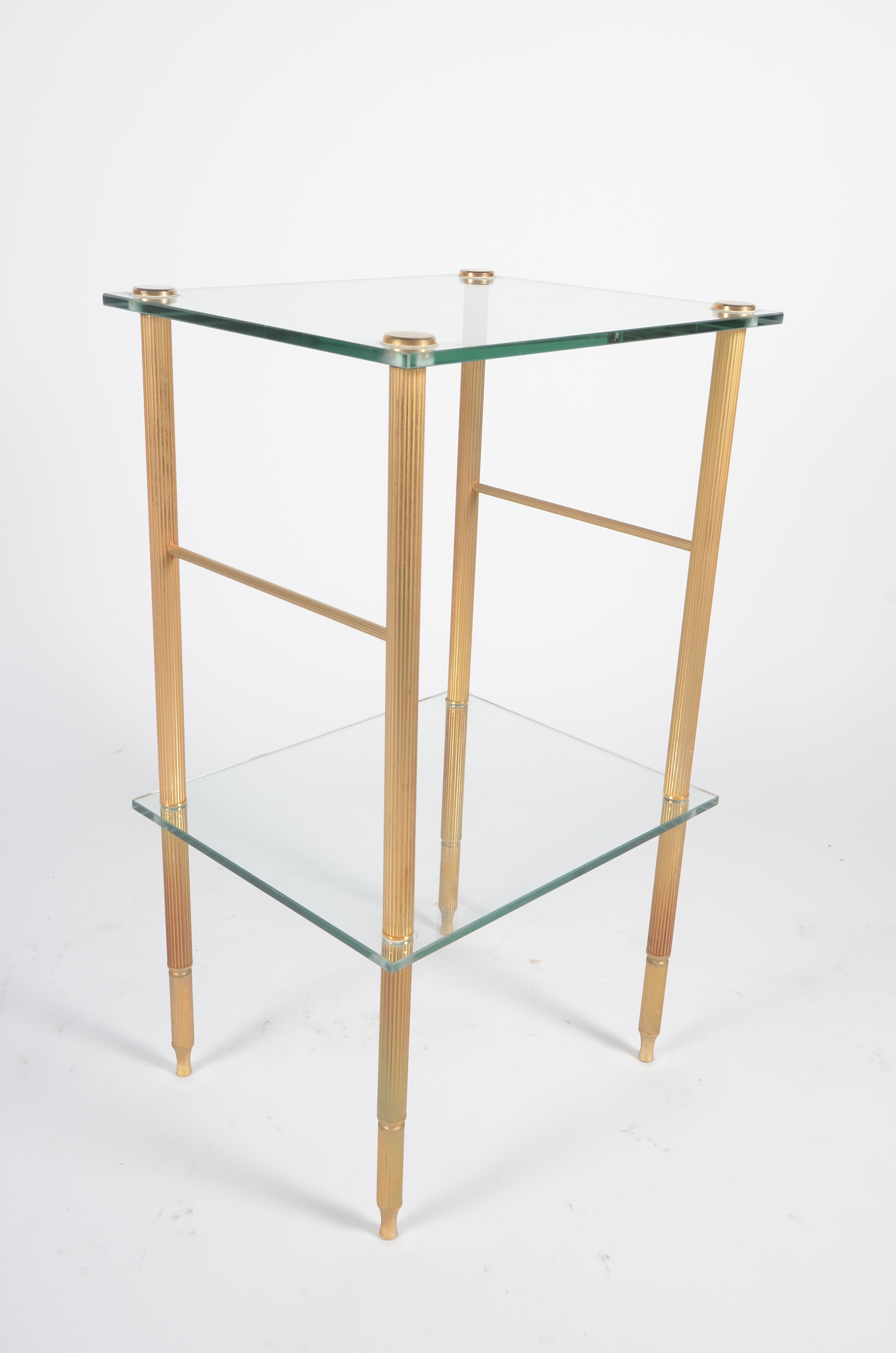 Glass and golden brass side table