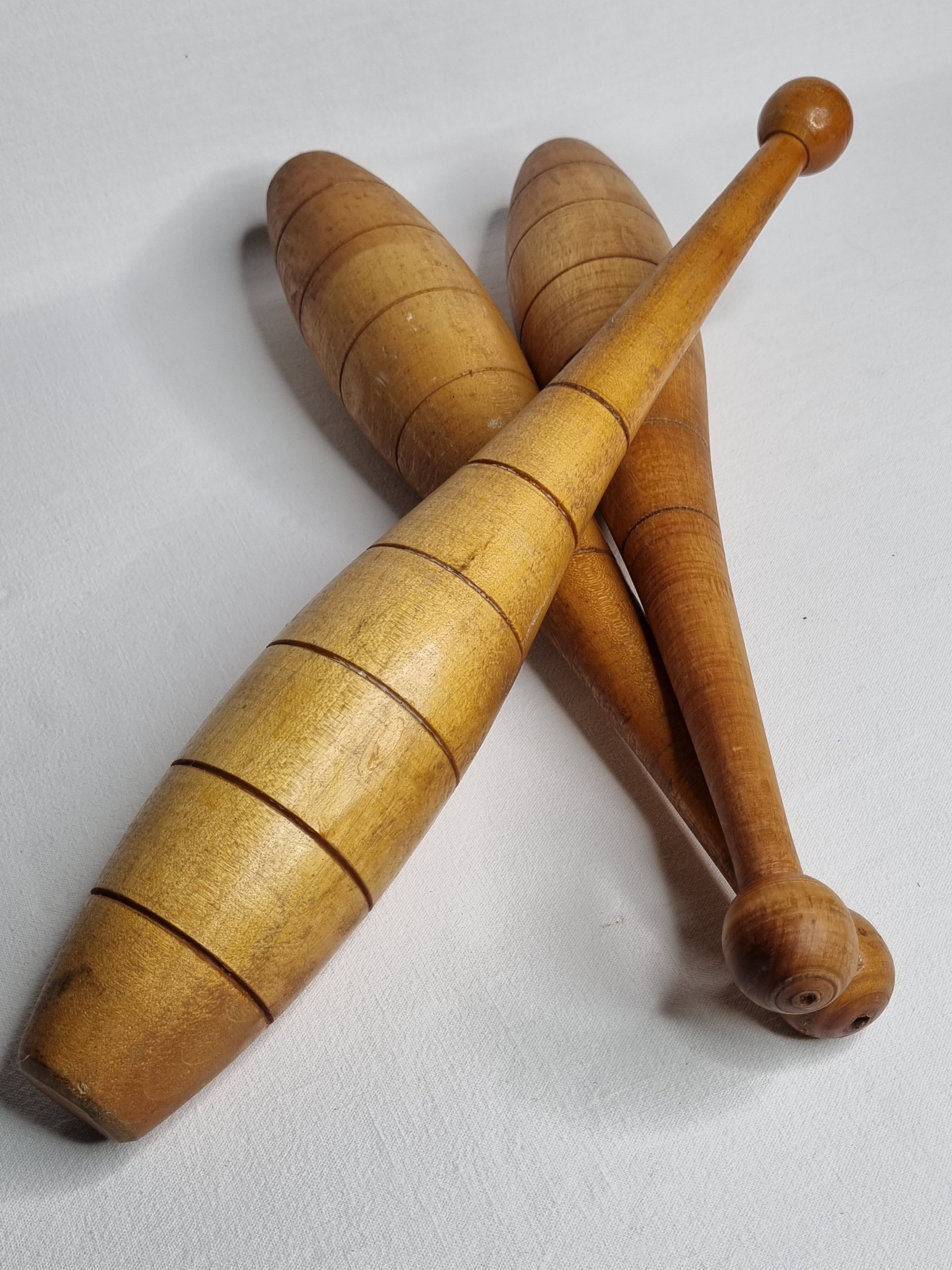 Set of three vintage juggling clubs in turned wood