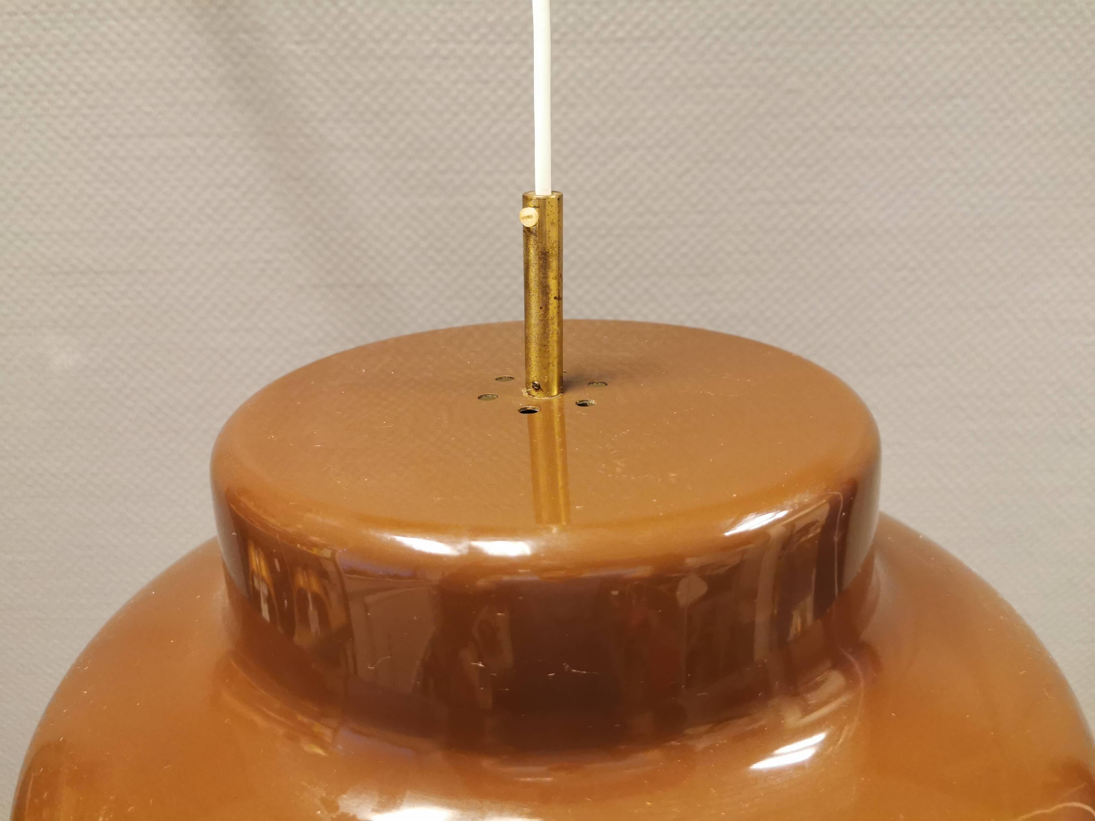 Large chocolate brown industrial-style hanging lamp, in lightweight metal.