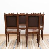 Set of 4 Louis XVI style chairs in carved wood and embossed leather.
