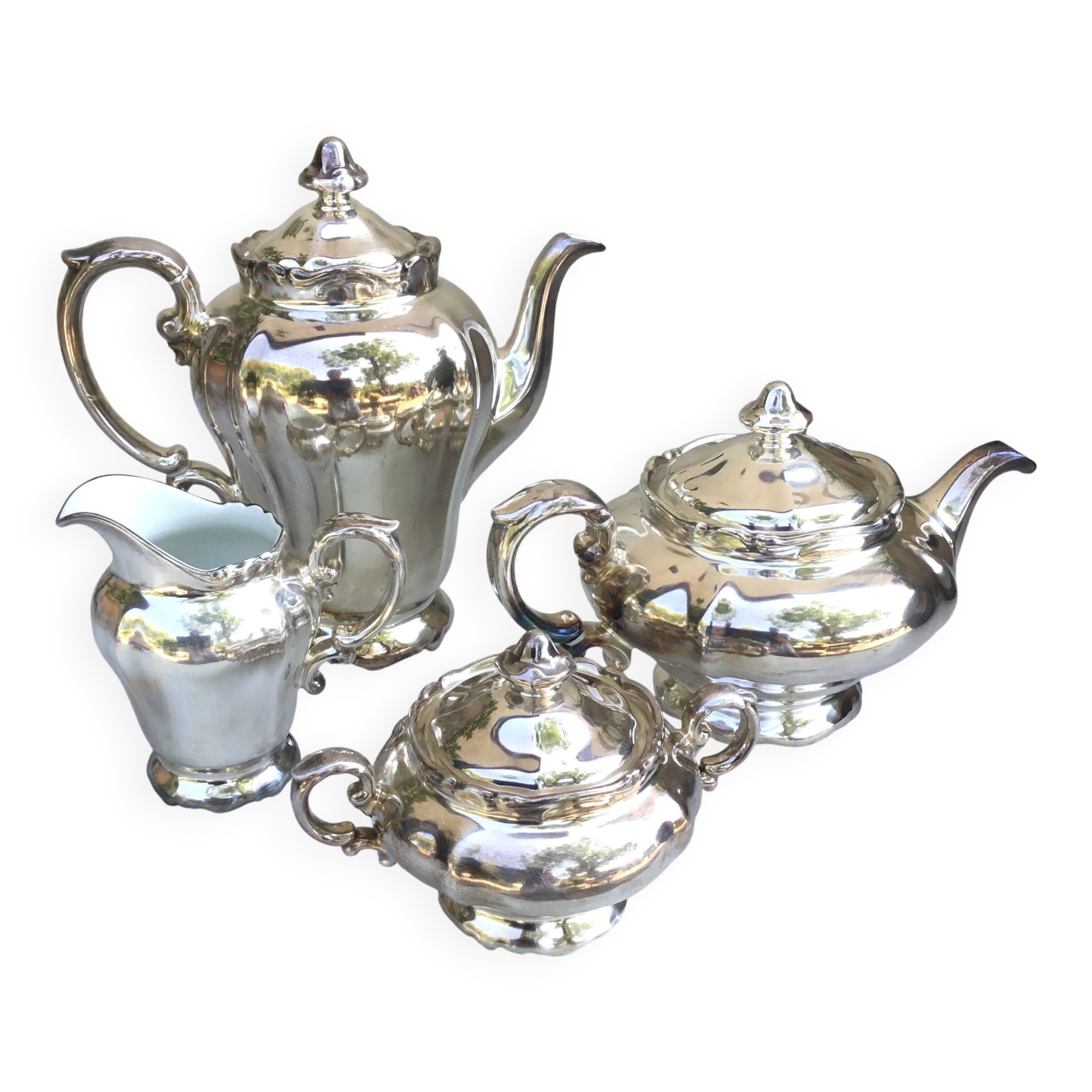 Tea and coffee service in porcelain and silvered enamel.