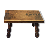 Footstool in varnished wood turns old