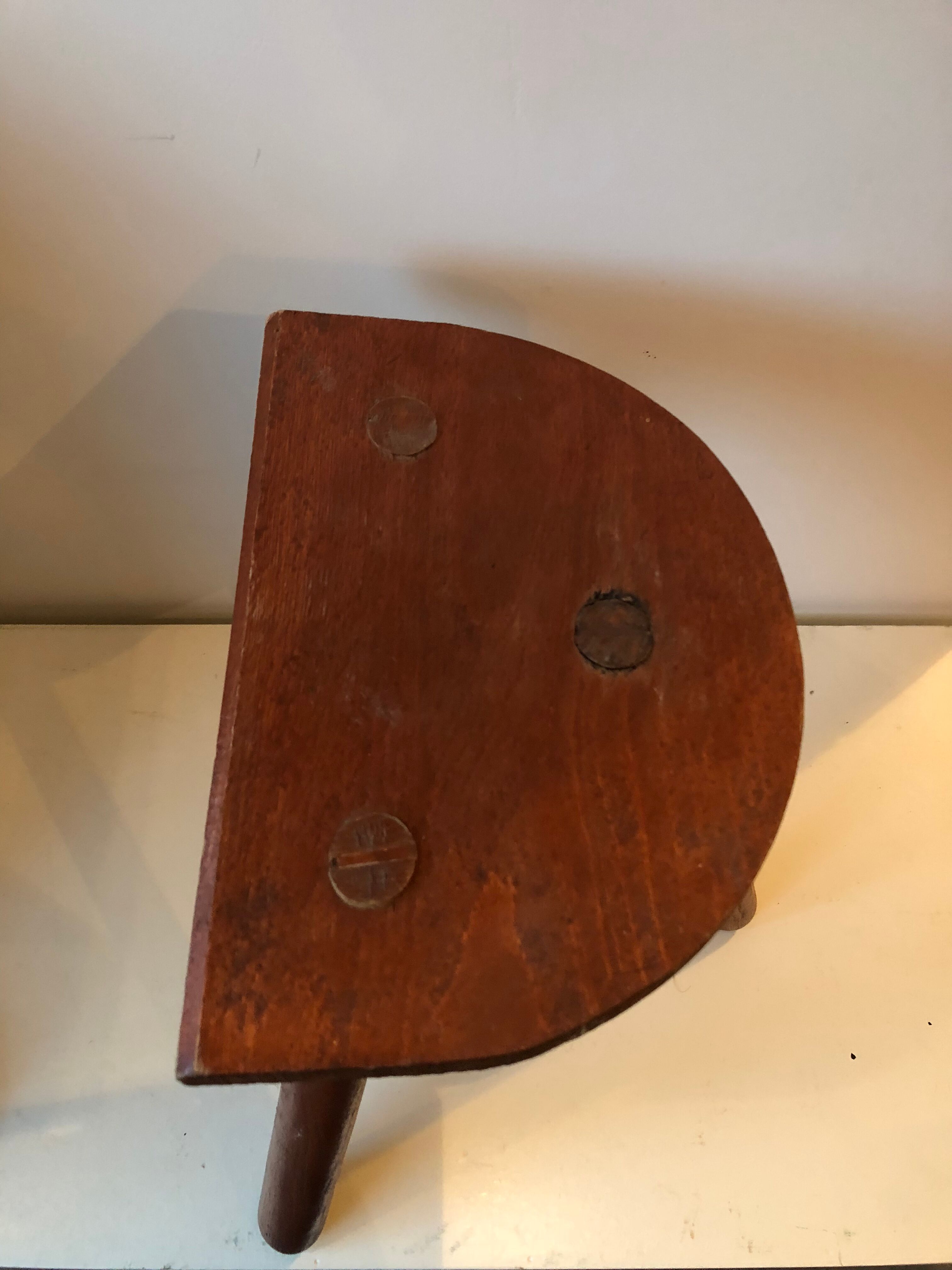 Old wooden tripod stool