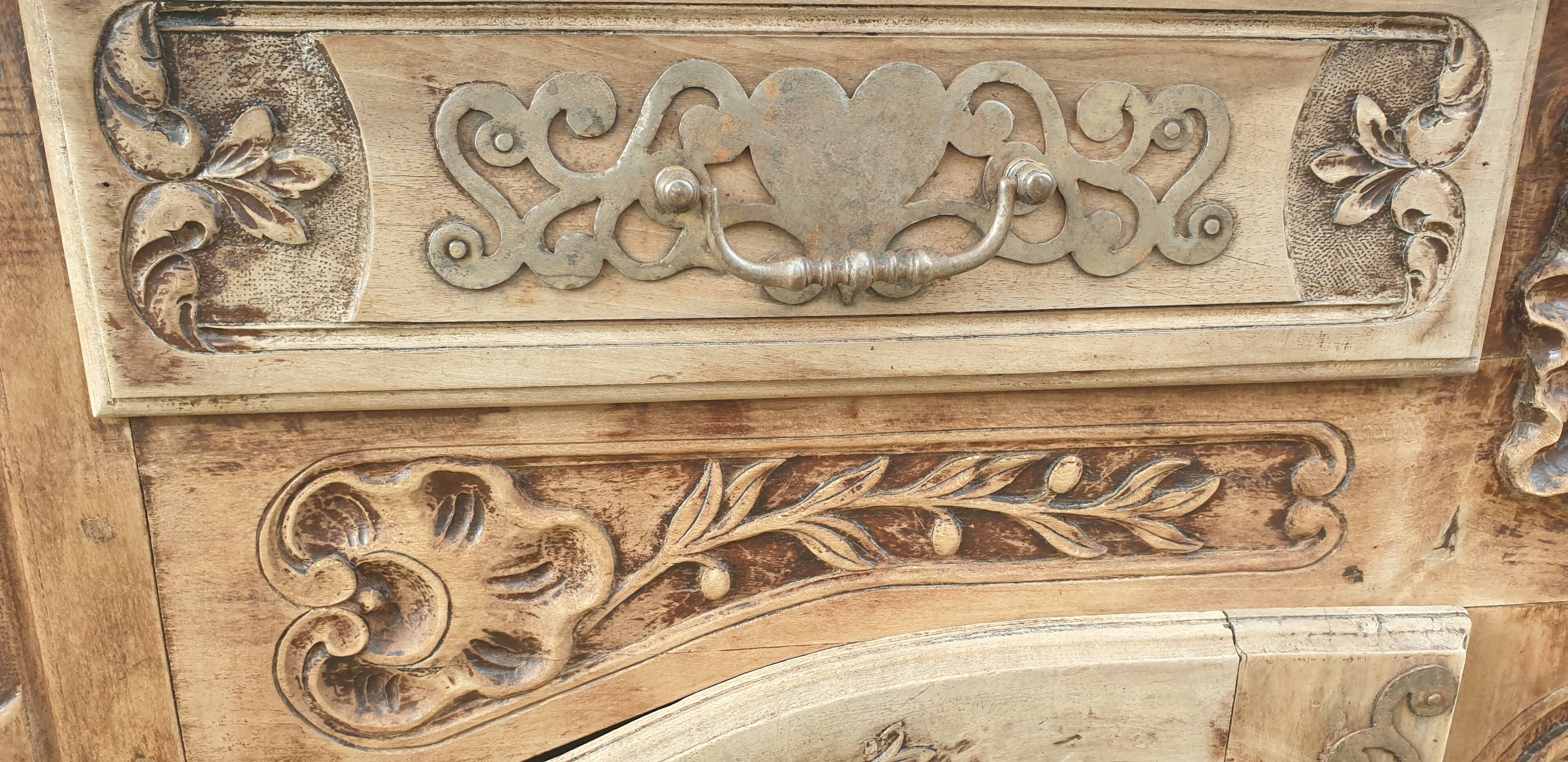 Provencal furniture in finely carved light walnut with wrought ironwork