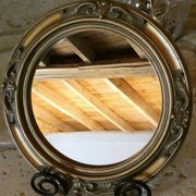 Round golden mirror