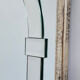 Large Art Deco style beveled wall mirror with architectural arch design