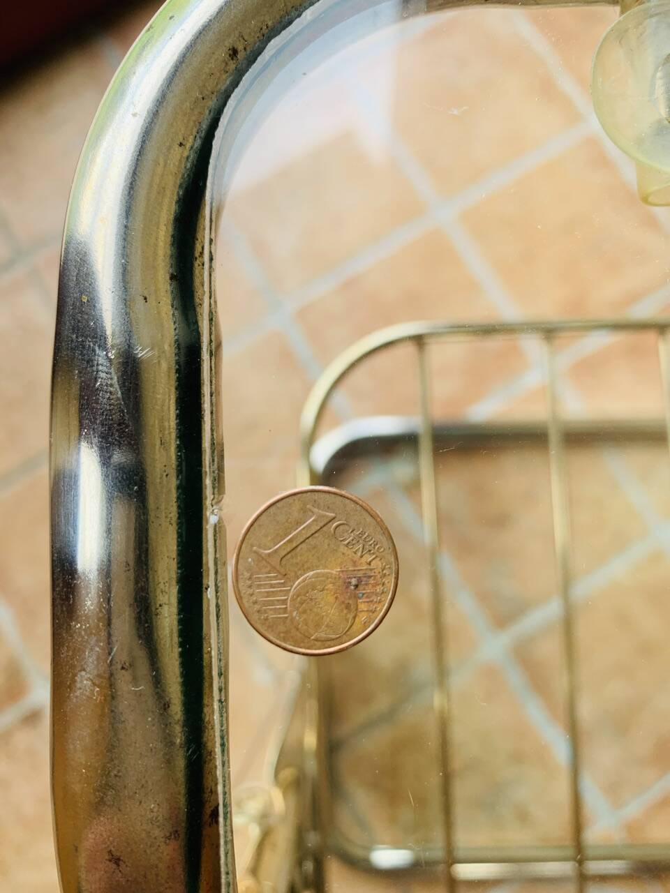 Glass and brass side table with magazine rack, circa 1970's