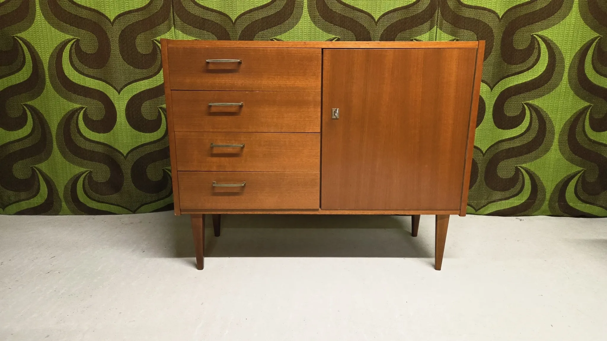 Small vintage sideboard from the 1960s with 4 drawers and a door.