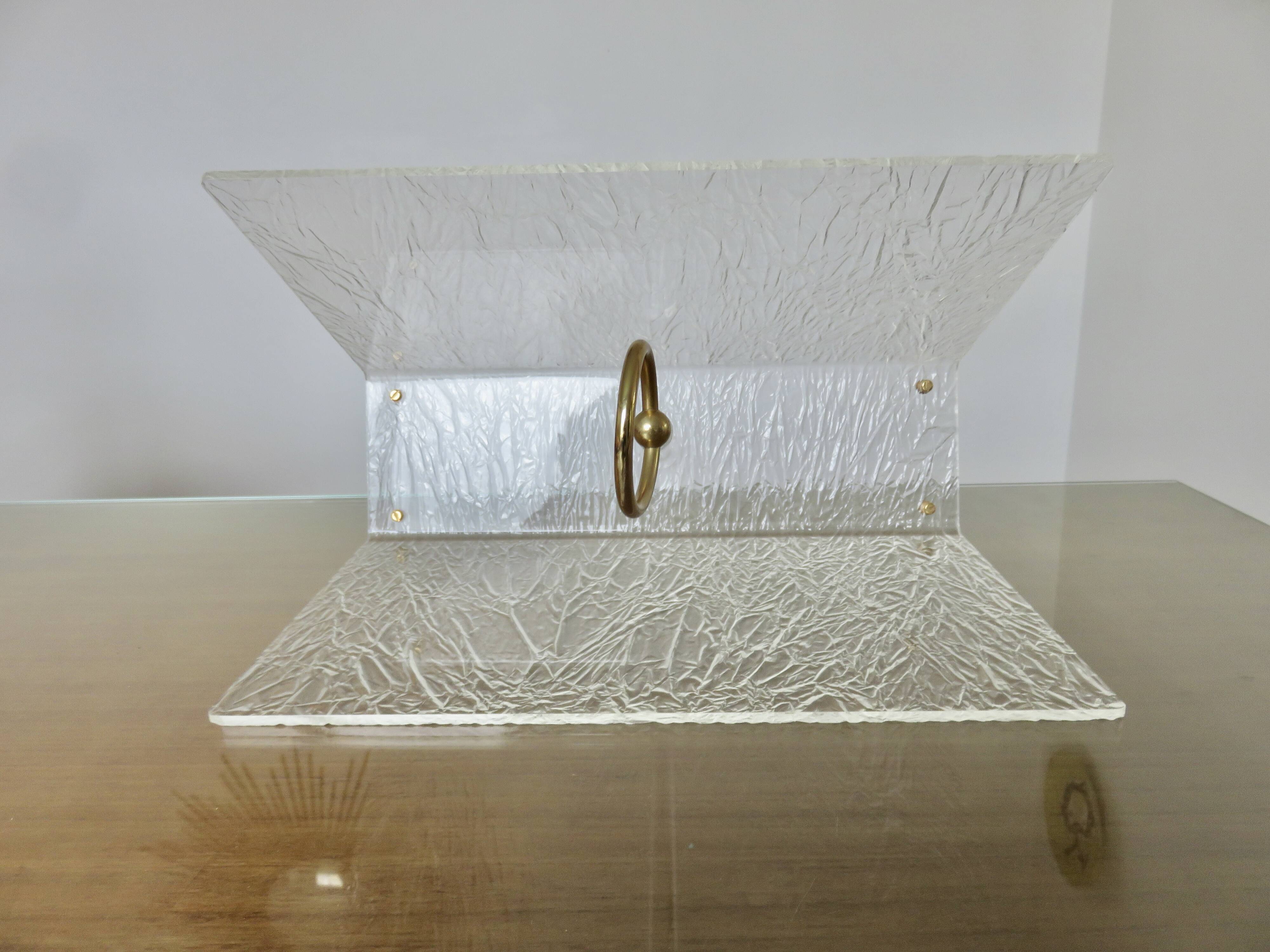 "Roche Bobois" magazine rack in lucite, plexiglass, altuglas and brass, 1970