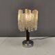 Table lamp with a teak ‘trunk’, silver-coloured metal base, acrylic shade