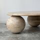 Circular travertine coffee table